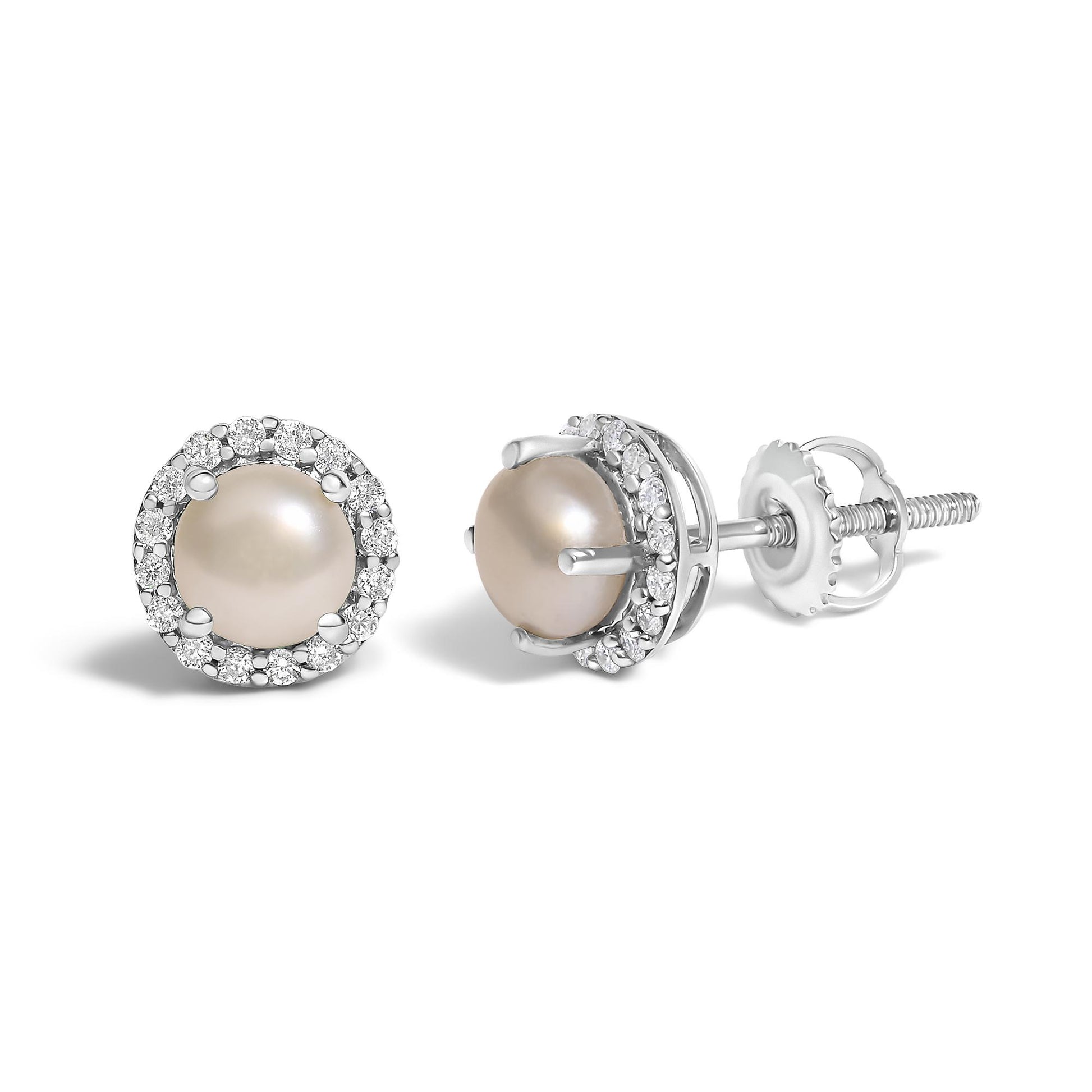 Pair of white metal stud earrings with round peach-colored center gemstones, surrounded by a halo of small round white gemstones in shared prong settings, shown from a front and side angle on a white background.