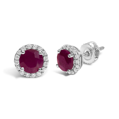 Close-up front and side angle of white metal stud earrings featuring a central round red gemstone surrounded by a circle of small round white gemstones in shared prong settings.