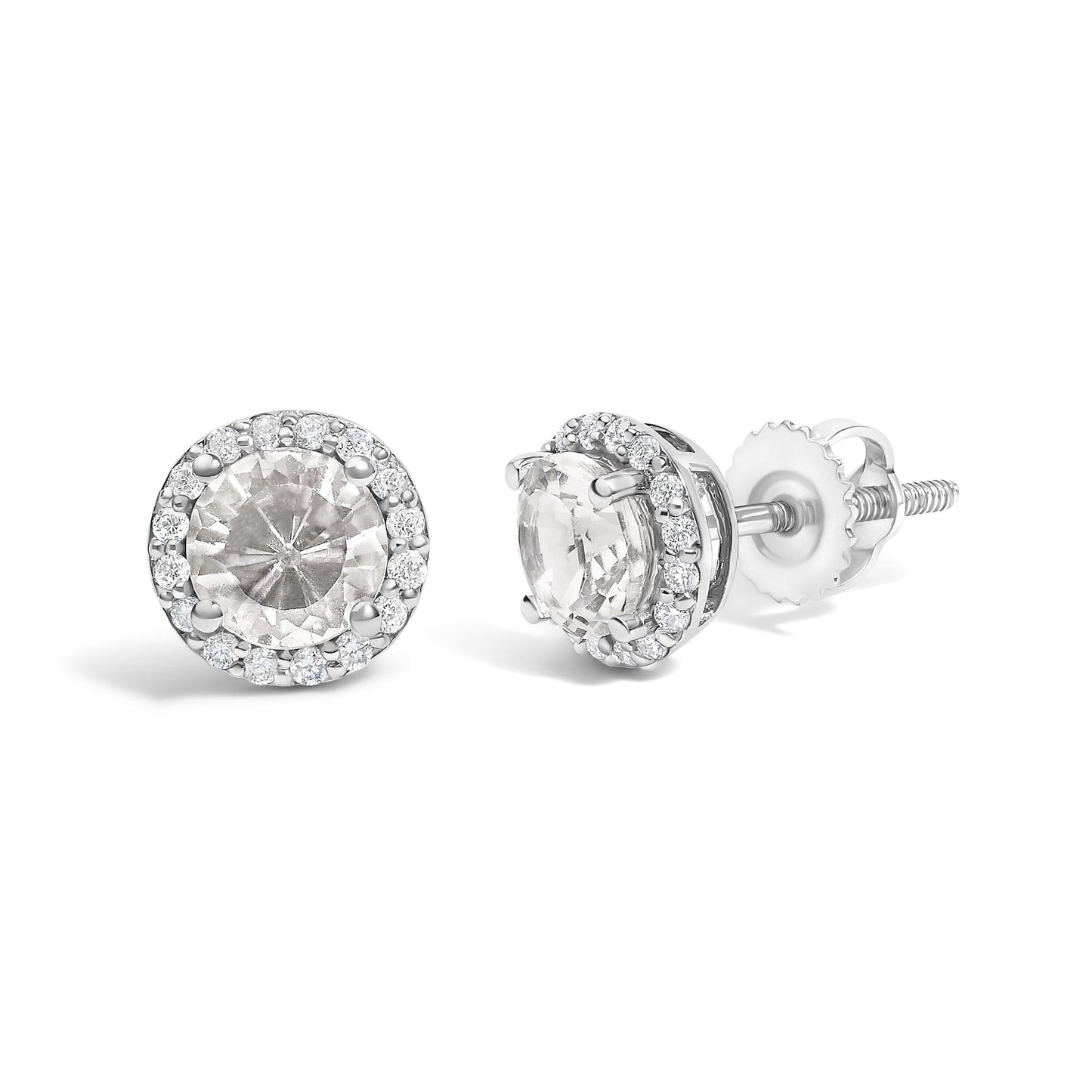 Pair of white metal stud earrings with round white gemstones in 4-prong settings surrounded by a halo of smaller round white gemstones in shared prong settings, shown from front and side angles on a white background.