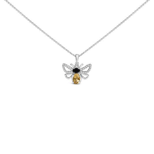 Front view of a white metal necklace with a bee-shaped pendant featuring one oval orange gemstone, one oval black gemstone, and multiple small round white gemstones, shown on a white background.