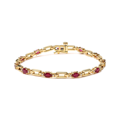Yellow bracelet with alternating oval-shaped red gemstones and round white gemstones in prong settings, shown from a front angle on a white background.