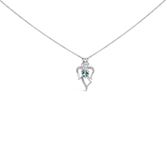 White metal necklace with an angel-shaped pendant featuring a heart-shaped blue gemstone at the center and small round white gemstones along the wings and body, shown in a front-facing close-up shot.