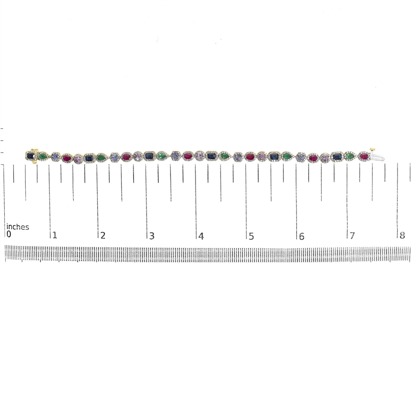 Yellow metal bracelet with a pattern of pear-shaped green gemstones, oval red gemstones, round pink and blue gemstones, emerald-shaped blue gemstones, and round white gemstones in prong settings, shown on a scale from overhead angle.