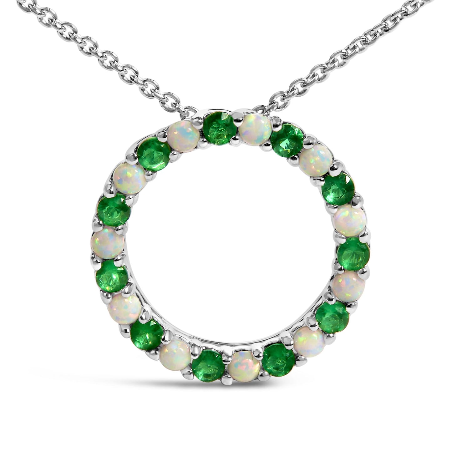 White metal circular necklace pendant featuring alternating round green and white gemstones in shared prong settings, shown in a front-facing close-up angle.