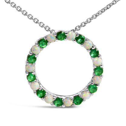 White metal circular necklace pendant featuring alternating round green and white gemstones in shared prong settings, shown in a front-facing close-up angle.