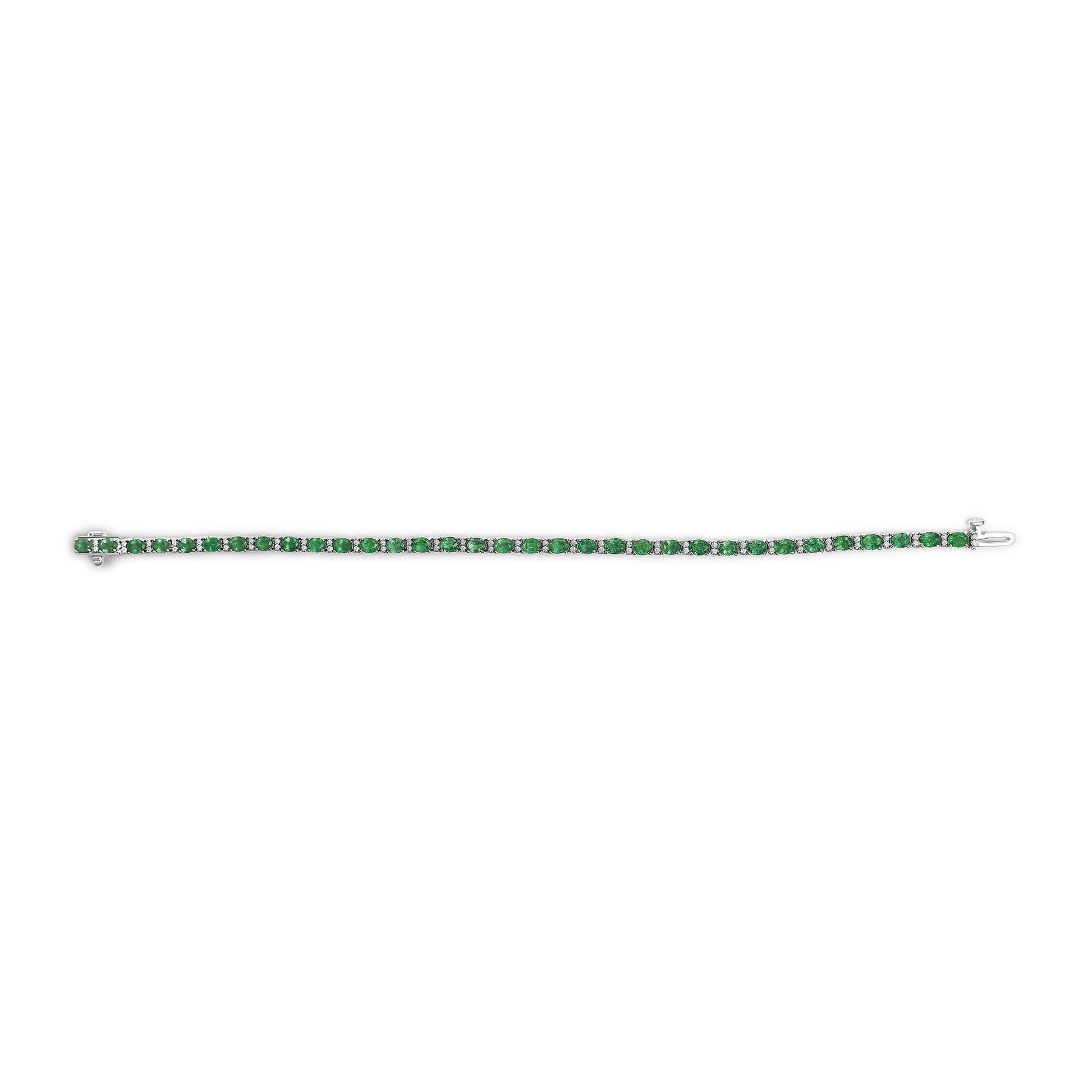 White metal bracelet with a single row of alternating green oval gemstones and white round gemstones, shown flat on a white background from a top-down angle.