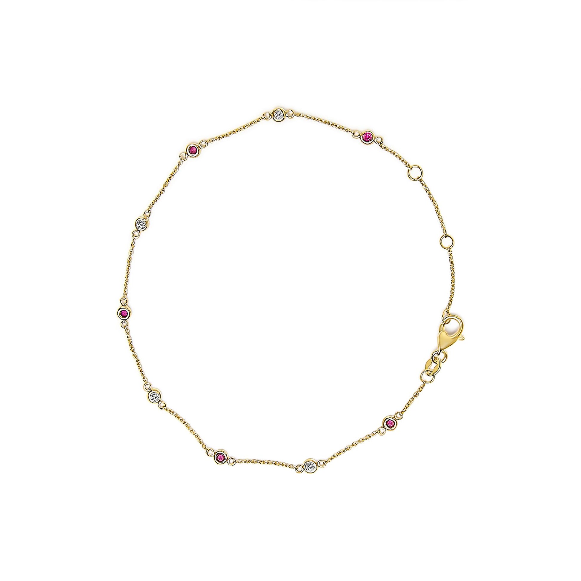 Top-down view of a yellow bracelet with alternating round white and red gemstones in bezel settings along a delicate chain and a lobster clasp.