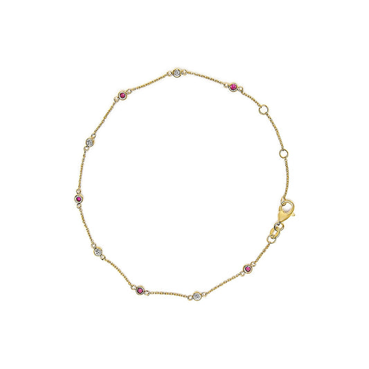 Top-down view of a yellow bracelet with alternating round white and red gemstones in bezel settings along a delicate chain and a lobster clasp.