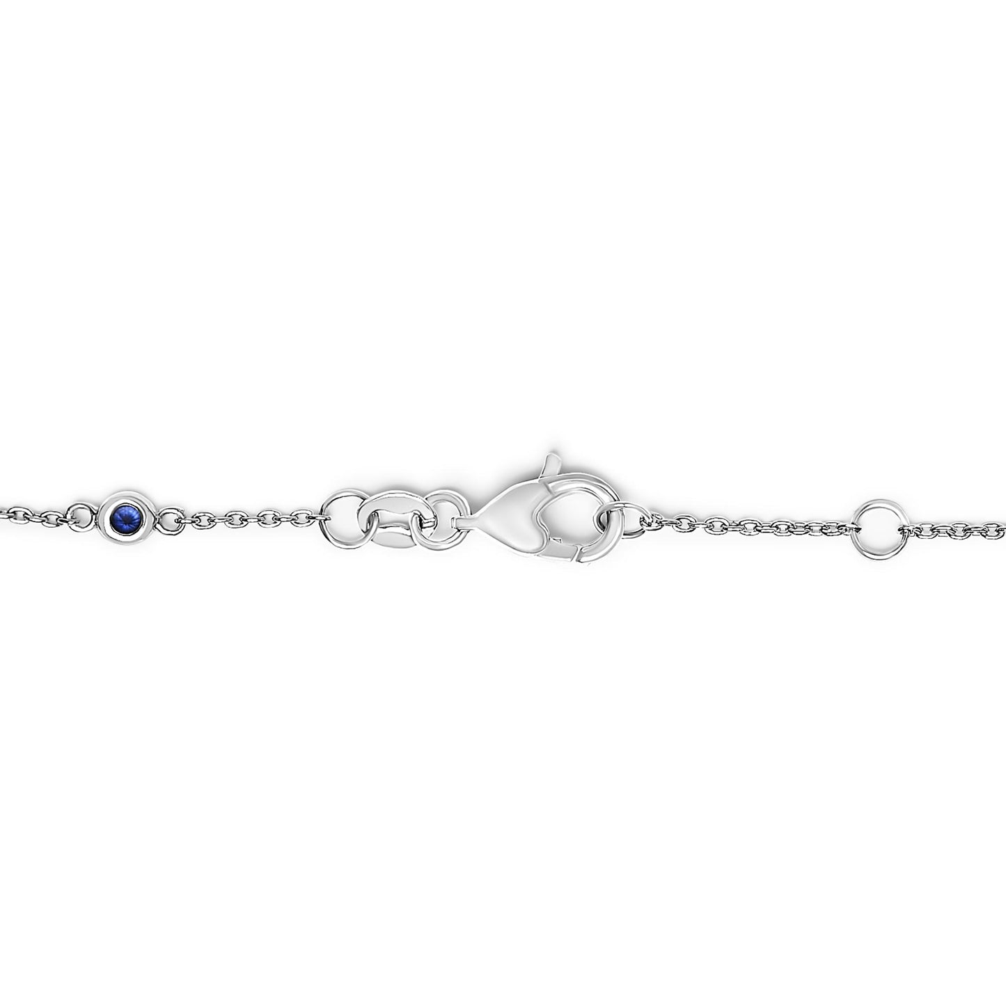 Close-up shot of a white bracelet chain with bezel-set round blue and white gemstones and a lobster clasp.