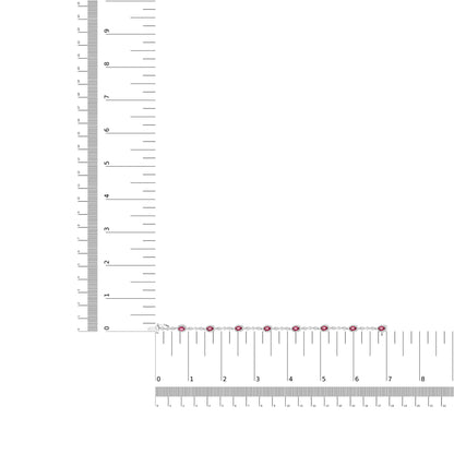 Bracelet with alternating red and white gemstones in prong settings on white metal, laid flat on rulers for size reference, top-down angle.
