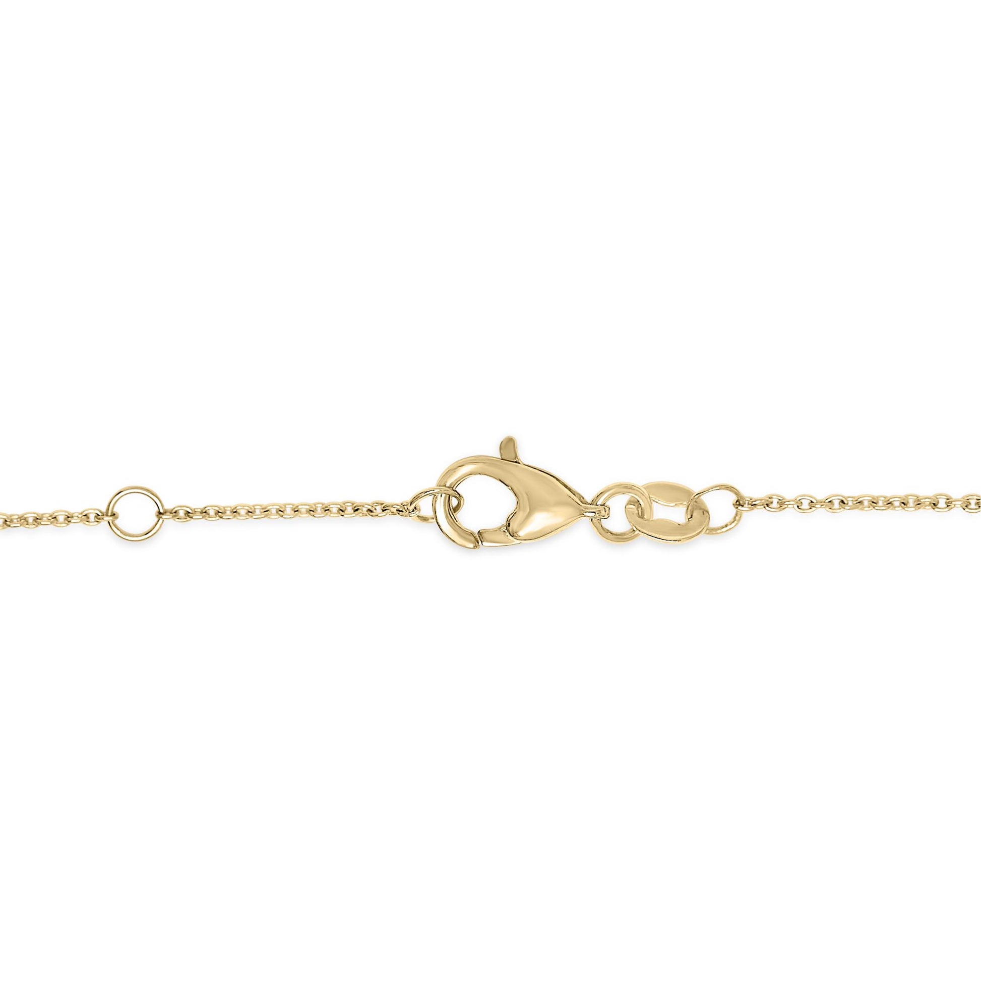 Close-up front angle of yellow metal bracelet chain and clasp, no gemstones visible.