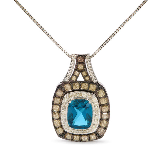 Close-up front view of a white necklace pendant featuring a cushion-shaped blue gemstone in the center, surrounded by layers of princess-shaped champagne and white gemstones in prong settings.