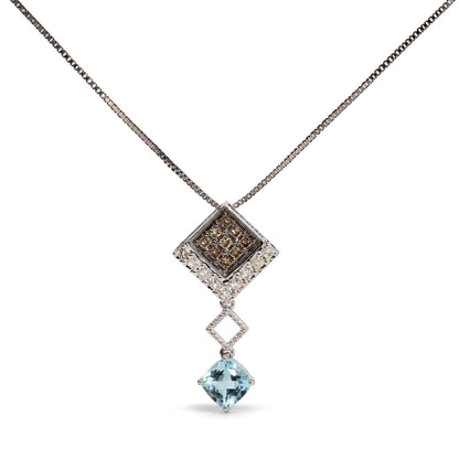 Close-up front view of a white metal necklace featuring a square pendant with two rows of champagne-colored princess-shaped gemstones set in prongs, connected to a smaller open diamond-shaped link, and finished with a large blue cushion-shaped gemstone in a four-prong setting, shown on a white background.
