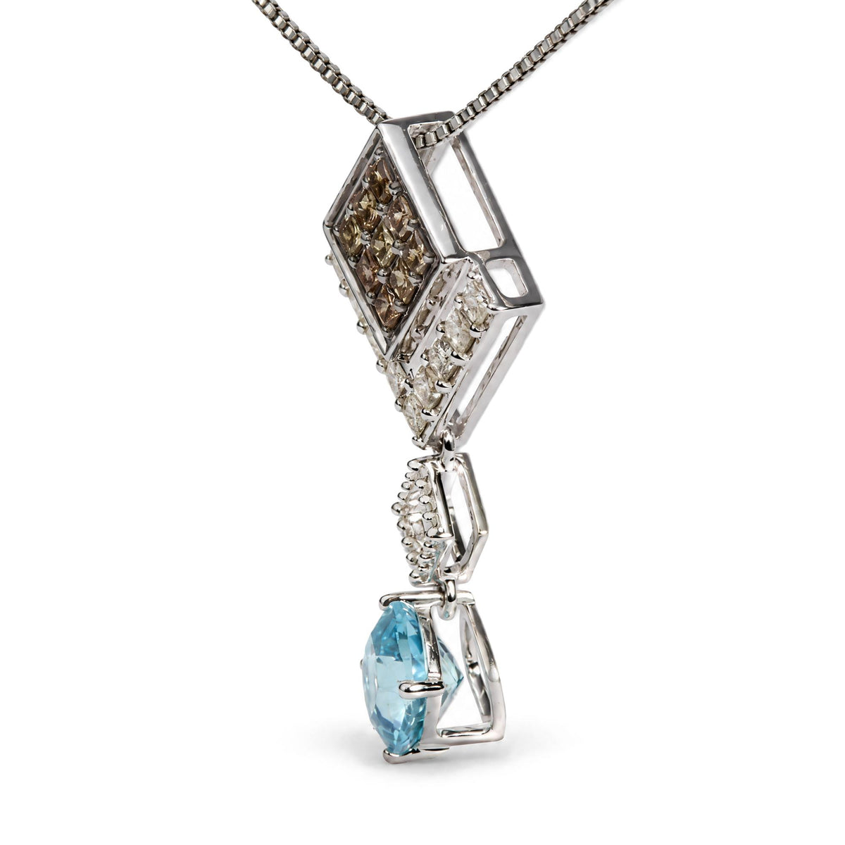 Close-up side angle of a white metal necklace pendant featuring square sections set with champagne-colored gemstones and a hanging blue cushion-shaped gemstone in a prong setting.