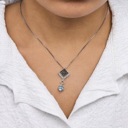 10K White Gold 5/8 Cttw Diamond and Created Cushion Blue Topaz Geometric Drop Pendant Necklace