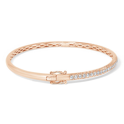 Rose-colored bracelet with a row of white round pave-set gemstones, shown from a slightly angled top view.