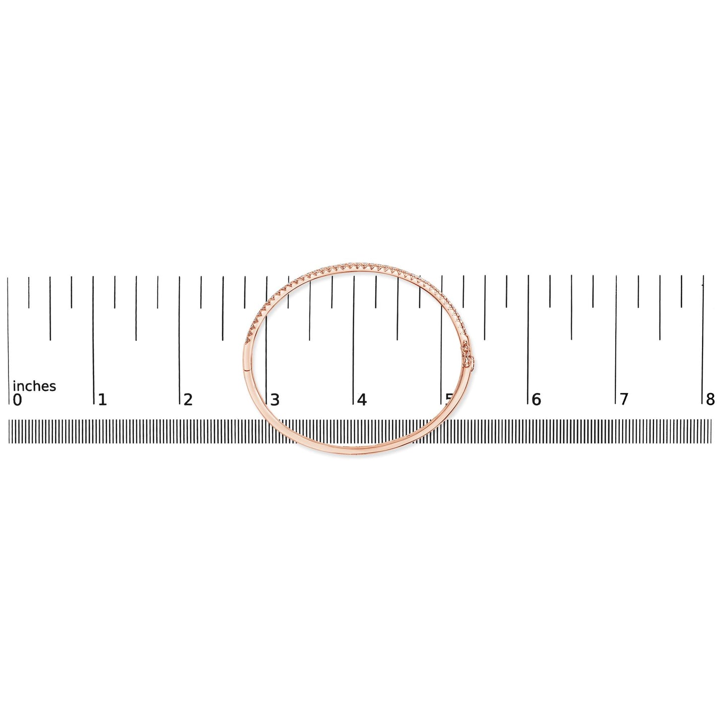 Rose metal bracelet with white gemstones in pave setting, shown flat on a ruler for size reference, top-down angle.