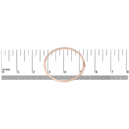 Rose metal bracelet with white gemstones in pave setting, shown flat on a ruler for size reference, top-down angle.