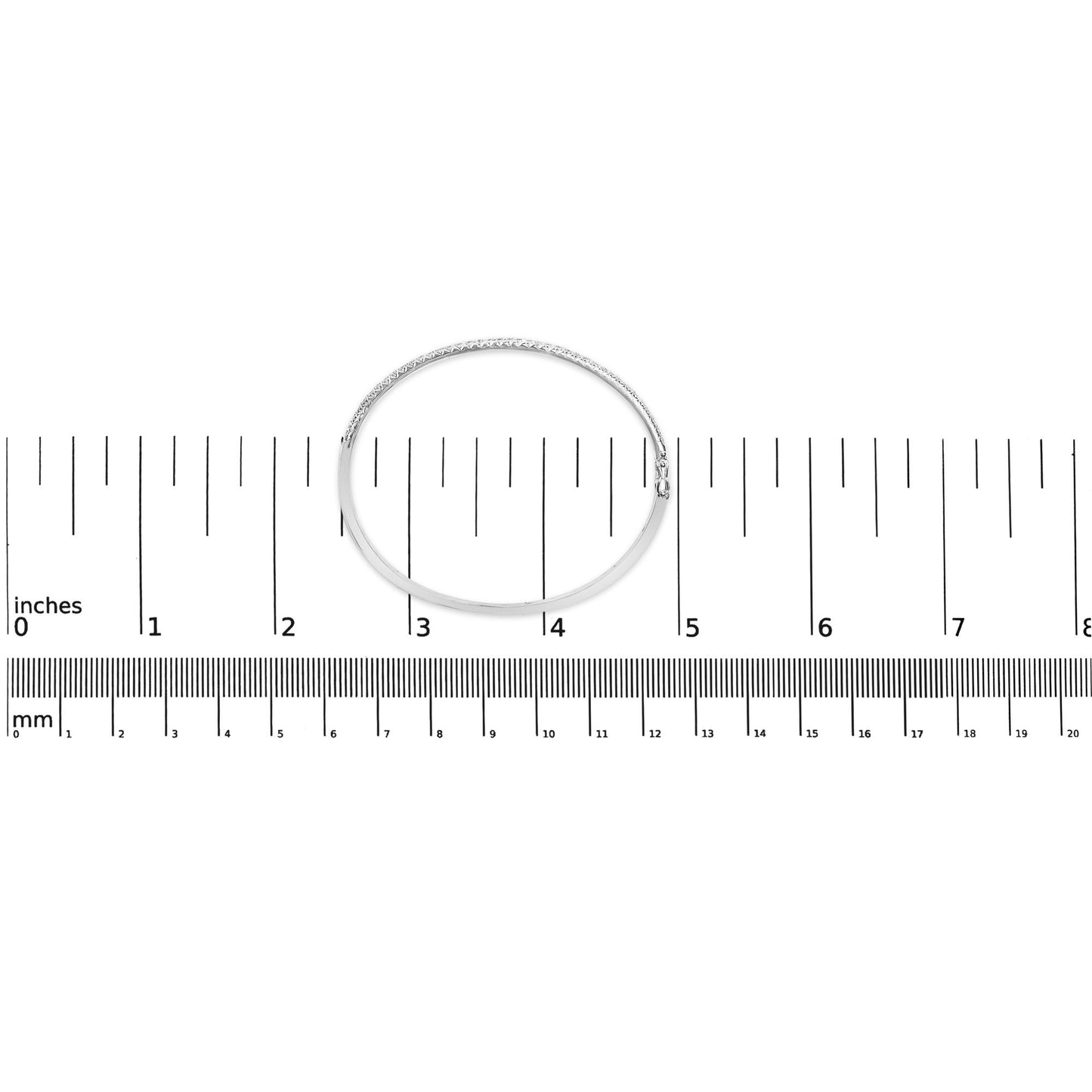 White metal bracelet with round pave-set white gemstones, shown flat on a ruler for size reference, top-down angle.