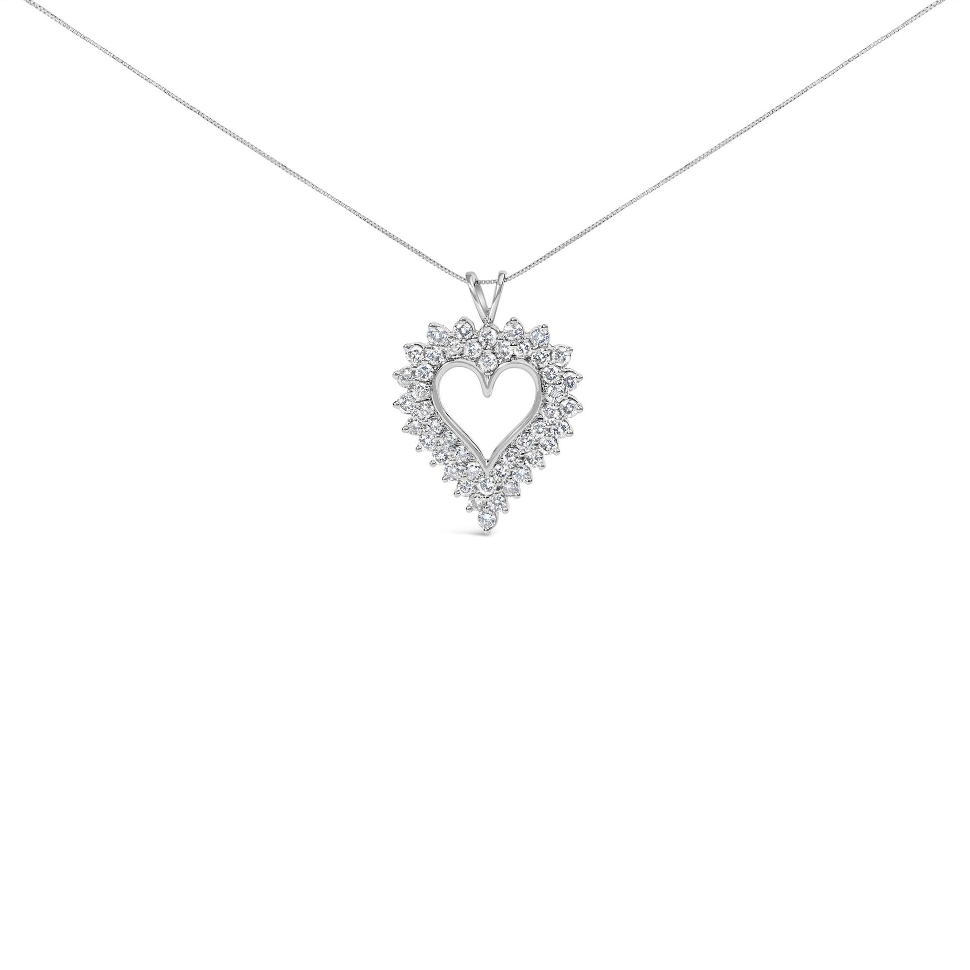 Front view of a white necklace with a heart-shaped pendant featuring prong-set round brownish gemstones.