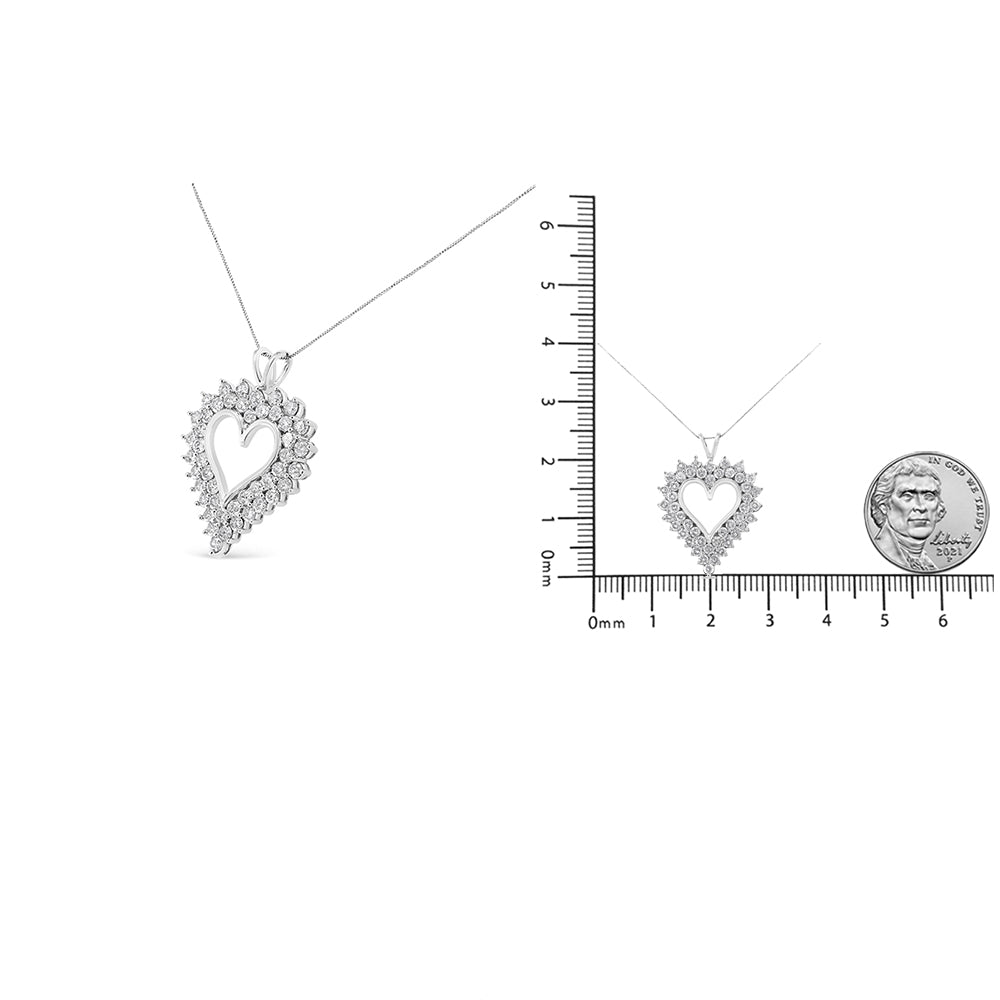 White necklace with asymmetrical heart-shaped pendant featuring round brownish gemstones in prong settings, shown at an angle and also displayed flat on a ruler with a coin for size reference.