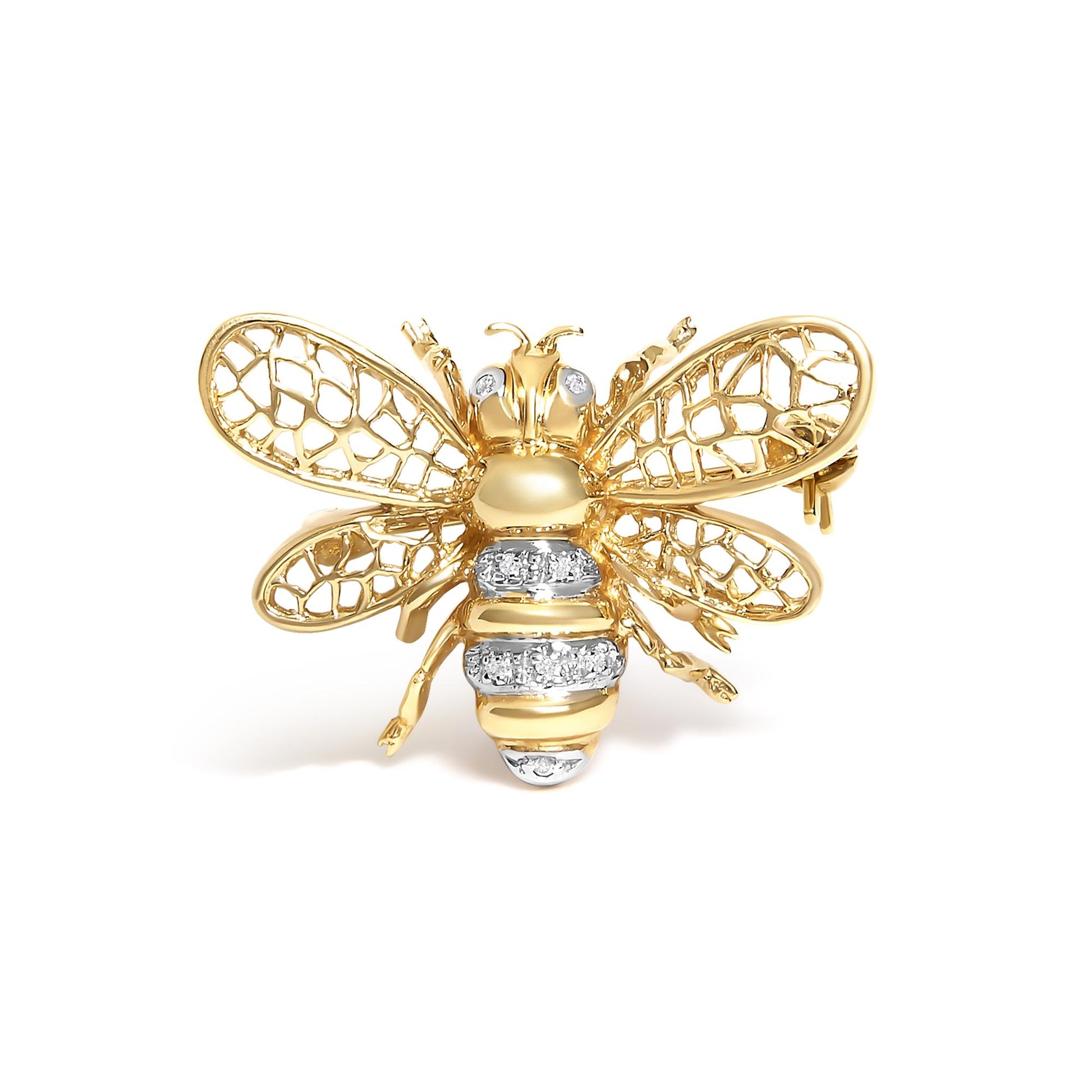 Close-up front view of a yellow and white metal bee-shaped brooch with openwork wings and white gemstones on the eyes and body.