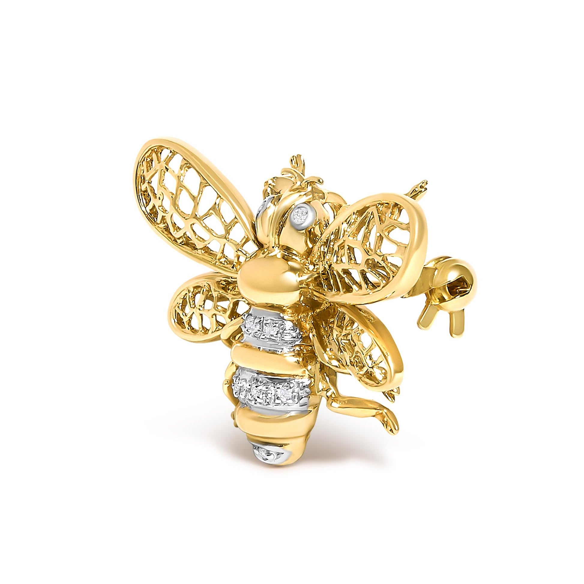 Close-up front angled view of a yellow and white metal bee-shaped brooch with openwork wings, decorated with round white gemstones on the eyes and body.