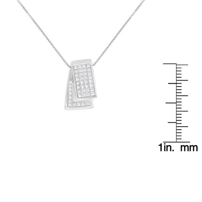 Close-up front angle of a white metal necklace with two overlapping rectangular pendants set with multiple white princess-shaped gemstones, shown with a ruler for size reference.