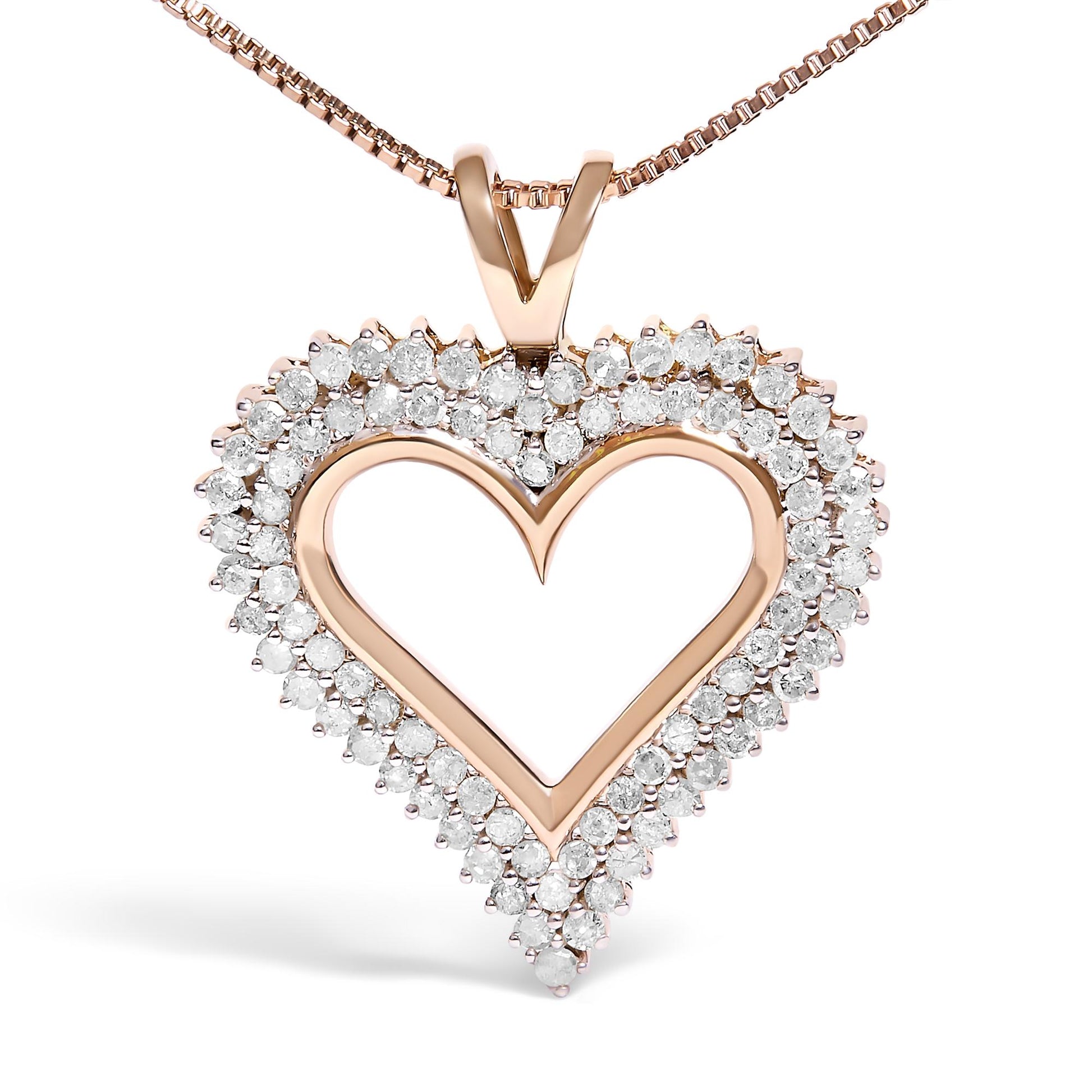 Close-up front view of a rose metal heart-shaped necklace pendant with two rows of round white gemstones in prong settings surrounding the heart outline.