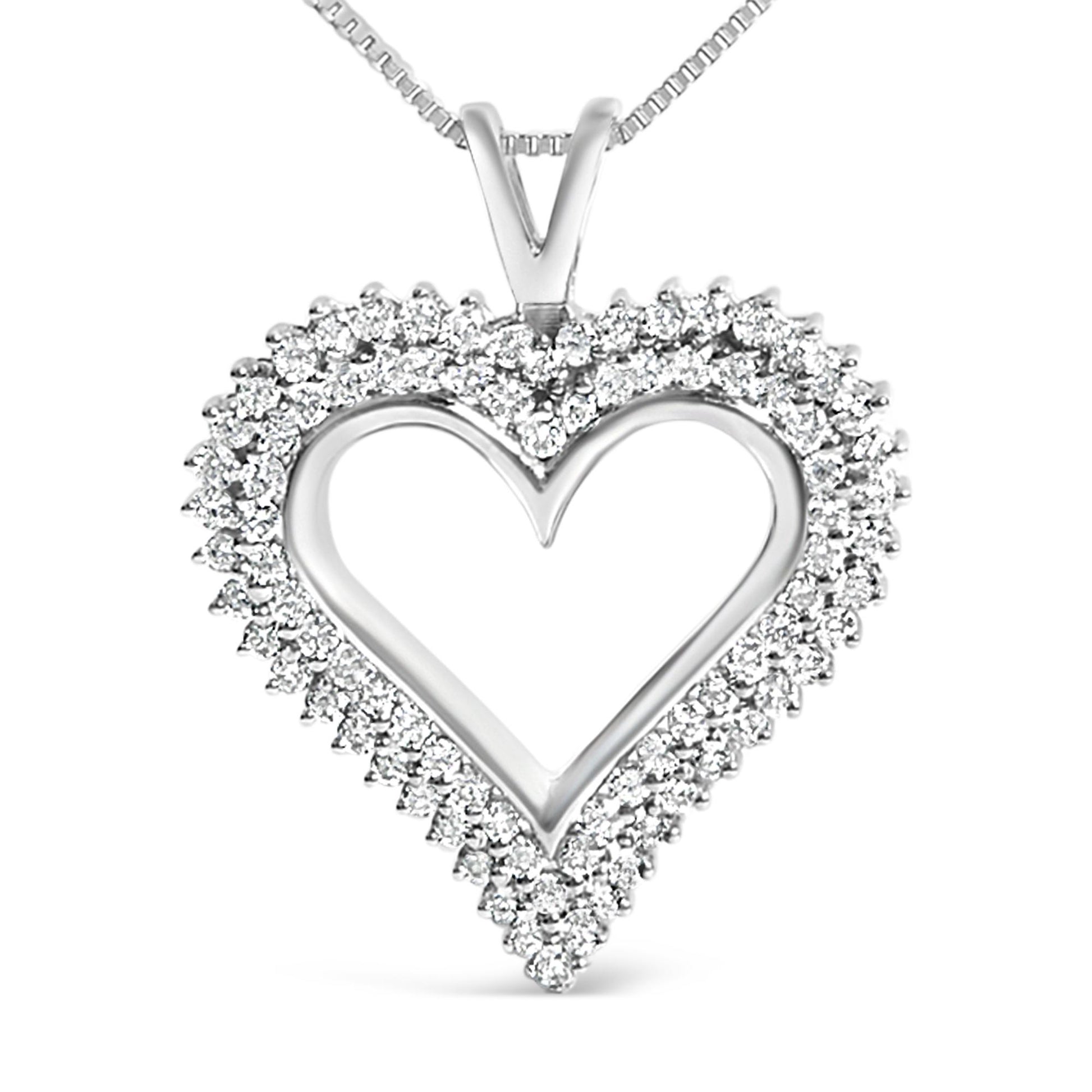 Close-up front view of a white metal heart-shaped necklace pendant outlined with round white gemstones in shared prong setting.