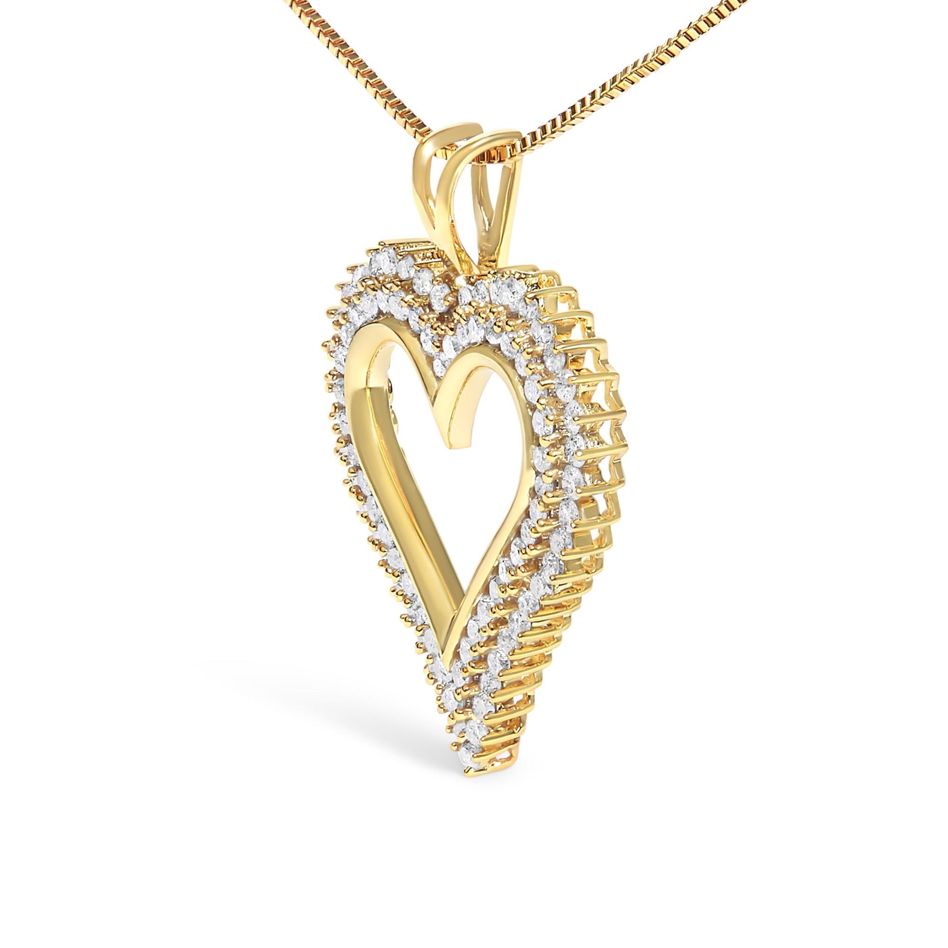 Yellow metal heart-shaped necklace pendant with prong-set round white gemstones around the edge, shown in a close-up angled view.
