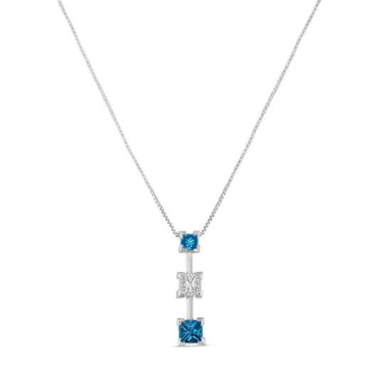 Front view of a white necklace with a vertical pendant featuring three princess-shaped prong-set gemstones, two blue and one white in the center.