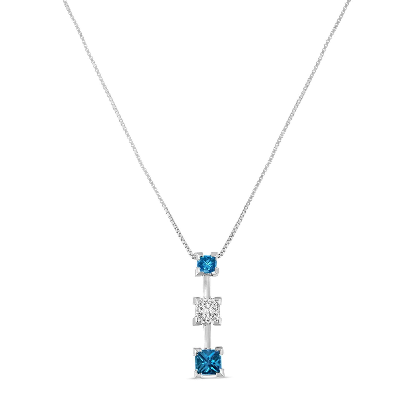 Front view of a white necklace with a vertical pendant featuring three princess-shaped prong-set gemstones, two blue and one white in the center.