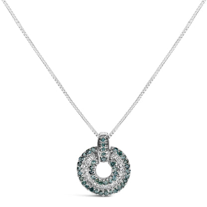 Front view of a white necklace with a circular pendant featuring two rows of blue round gemstones with prong settings surrounding inner rows of white baguette gemstones with channel settings.