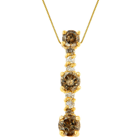 Front view of a yellow metal necklace pendant with vertically aligned round prong-set gemstones in white and champagne colors.