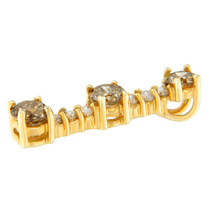 Close-up side angle of a yellow metal necklace pendant featuring round prong-set white and champagne-colored gemstones.