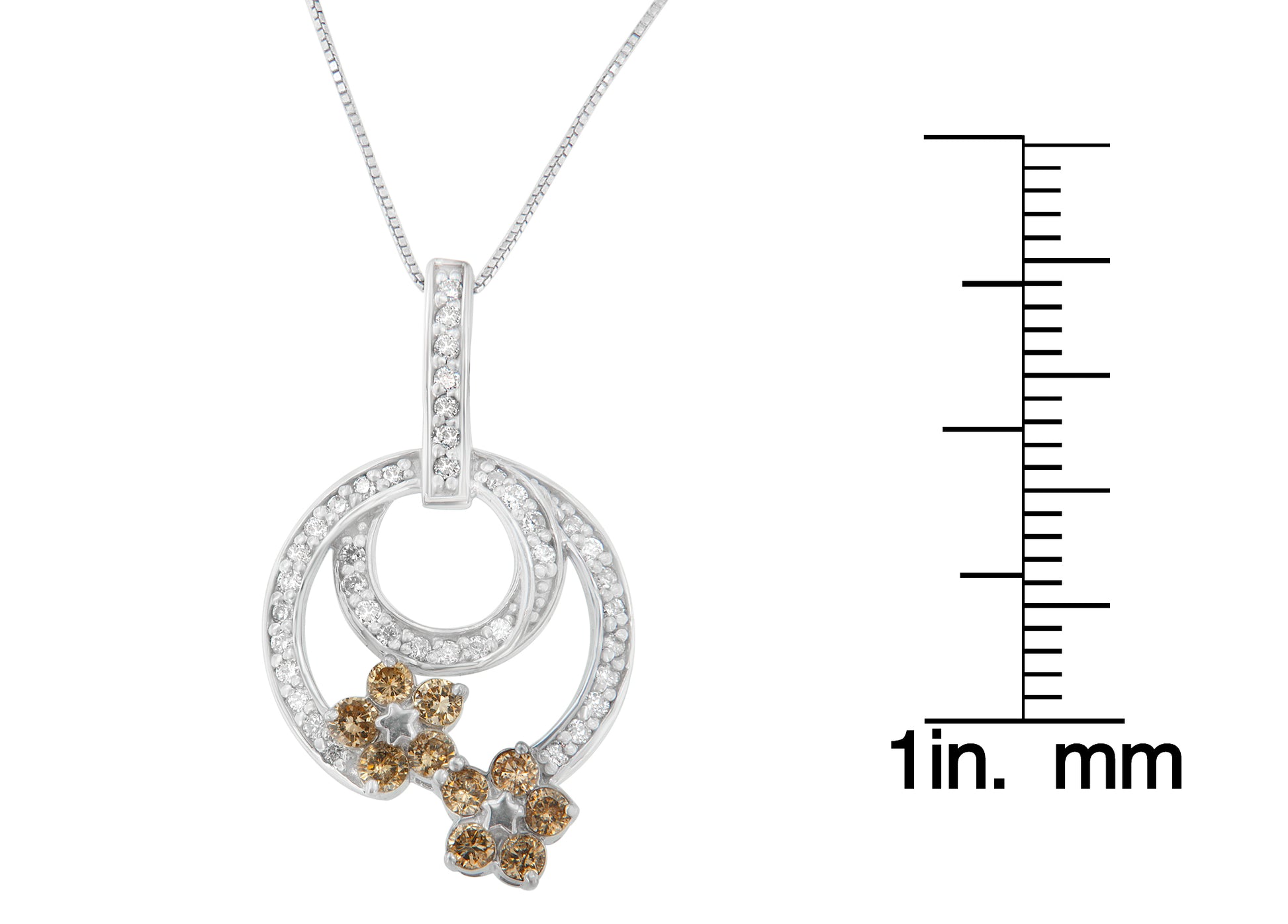 White metal necklace pendant with two overlapping circular designs set with round white gemstones, accented by two flower shapes with round champagne gemstones, shown hanging from a chain with a scale for size reference, front-facing angle.