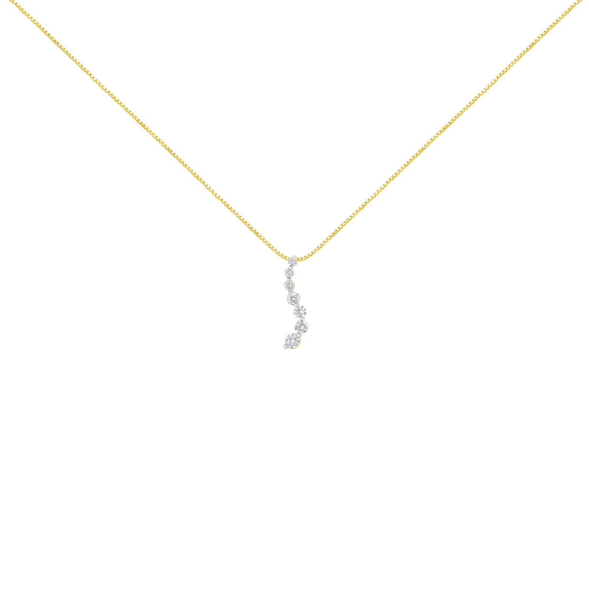 Front-facing shot of a yellow metal necklace with a vertical pendant featuring round white gemstones in prong settings.