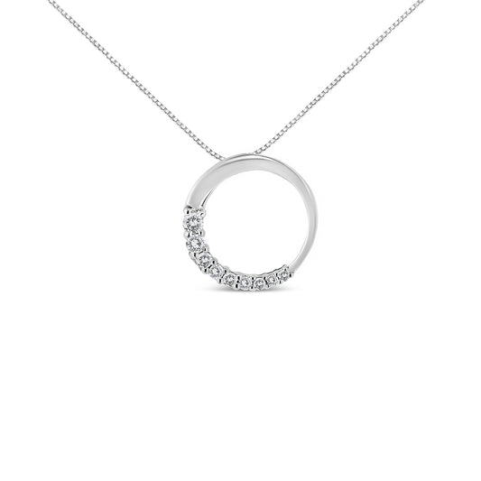 Front angle view of a white metal circular pendant necklace with half of the circle adorned with round white gemstones in prong settings.