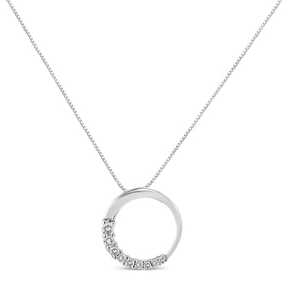 White metal necklace with a circular pendant featuring round white gemstones in prong settings along the lower left side, shown in a front-facing view.