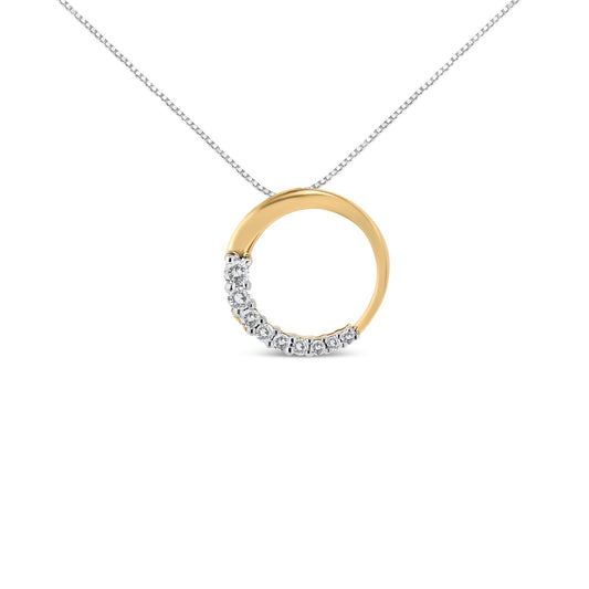 Front view of a yellow metal circular necklace pendant partially set with round white gemstones in a prong setting on a chain.