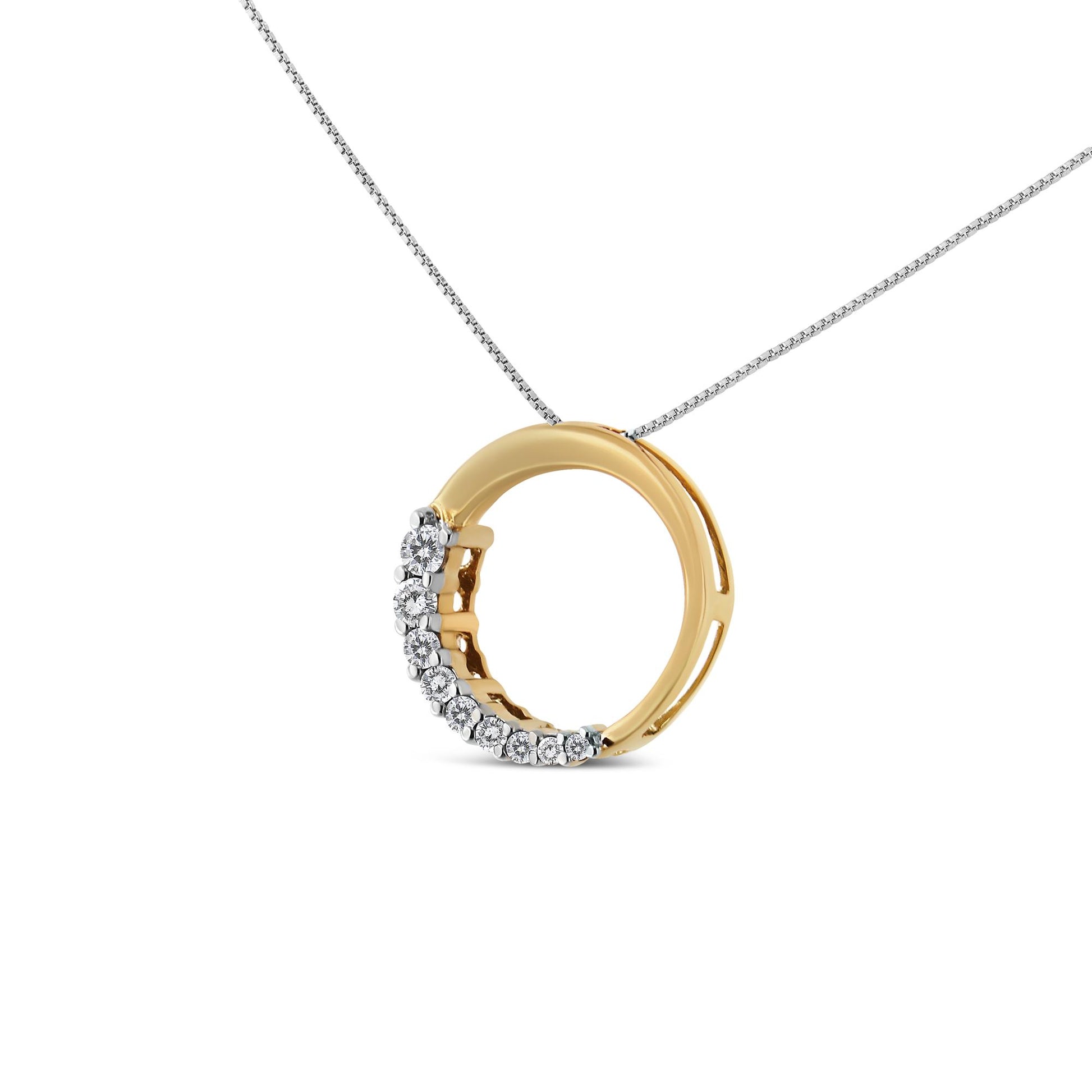 Yellow metal circular necklace pendant with prong-set white round gemstones along one side, shown from a front angle.