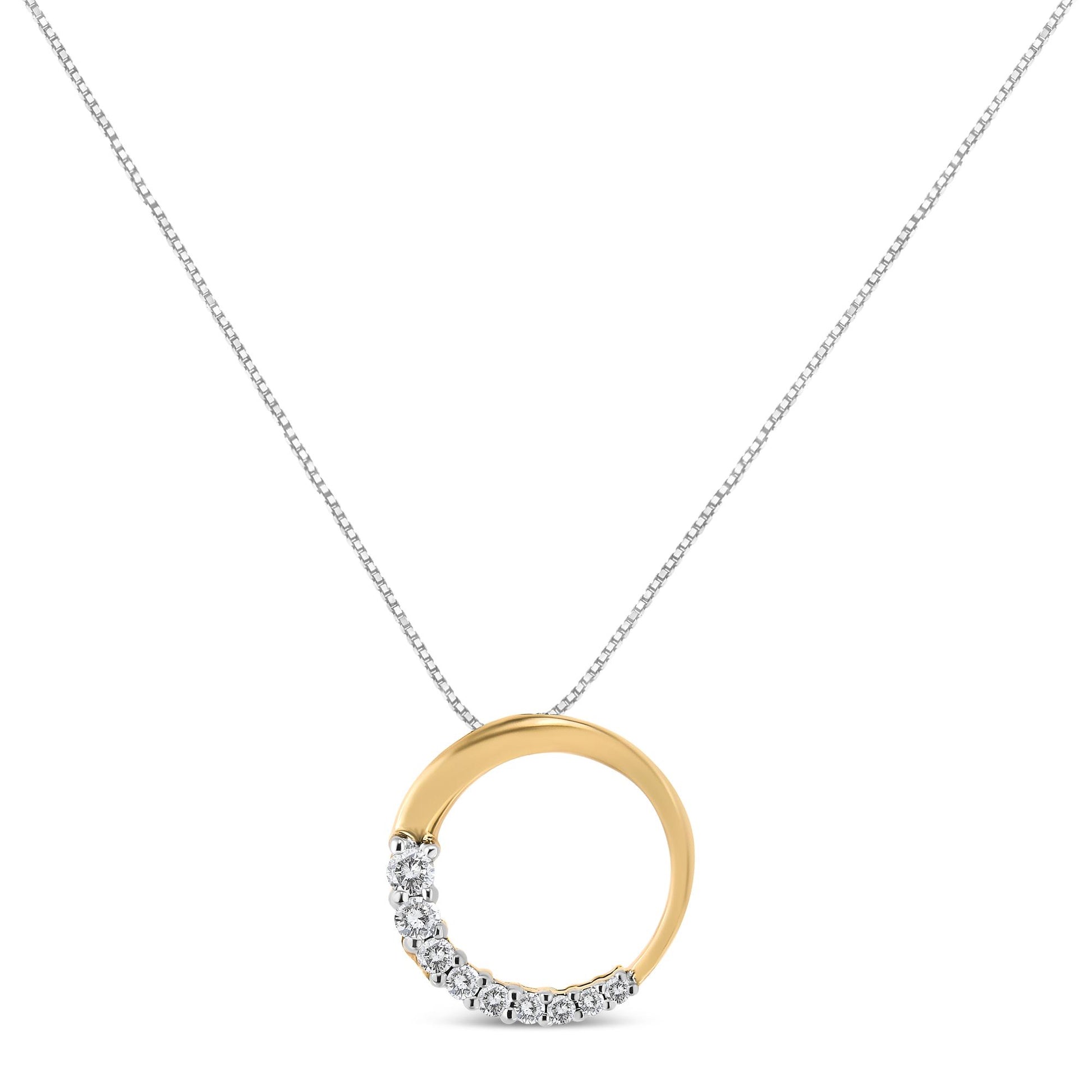 Front view of a yellow metal circular necklace pendant featuring a row of white round gemstones set in prongs along part of the circle, hanging from a fine chain.