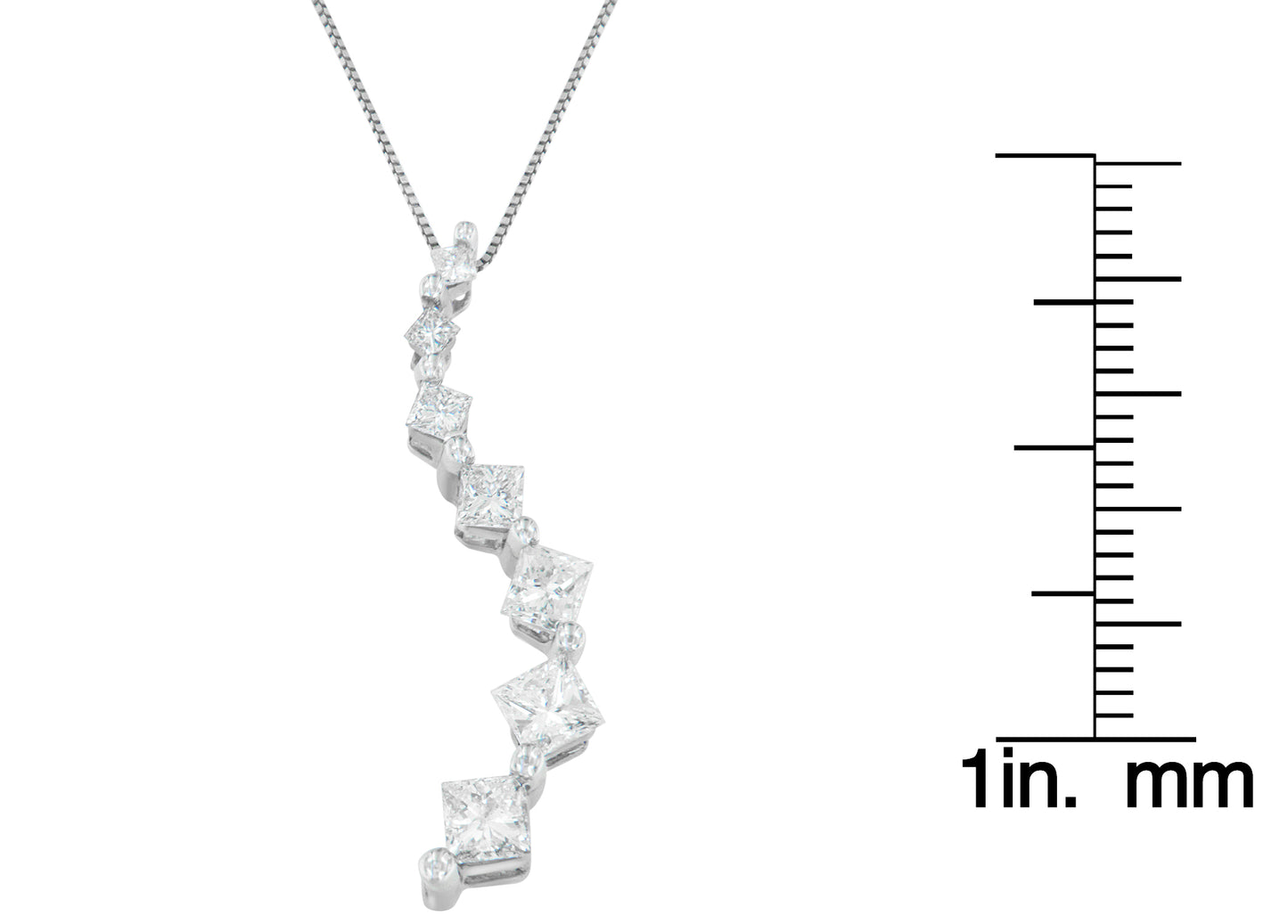 White metal necklace pendant with a curved design featuring prong-set princess shape white gemstones and channel-set baguette shape white gemstones, shown in a front angle next to a ruler for size reference.