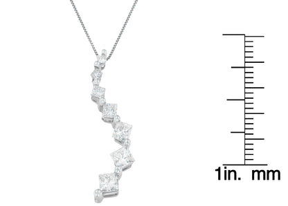 White metal necklace pendant with a curved design featuring prong-set princess shape white gemstones and channel-set baguette shape white gemstones, shown in a front angle next to a ruler for size reference.