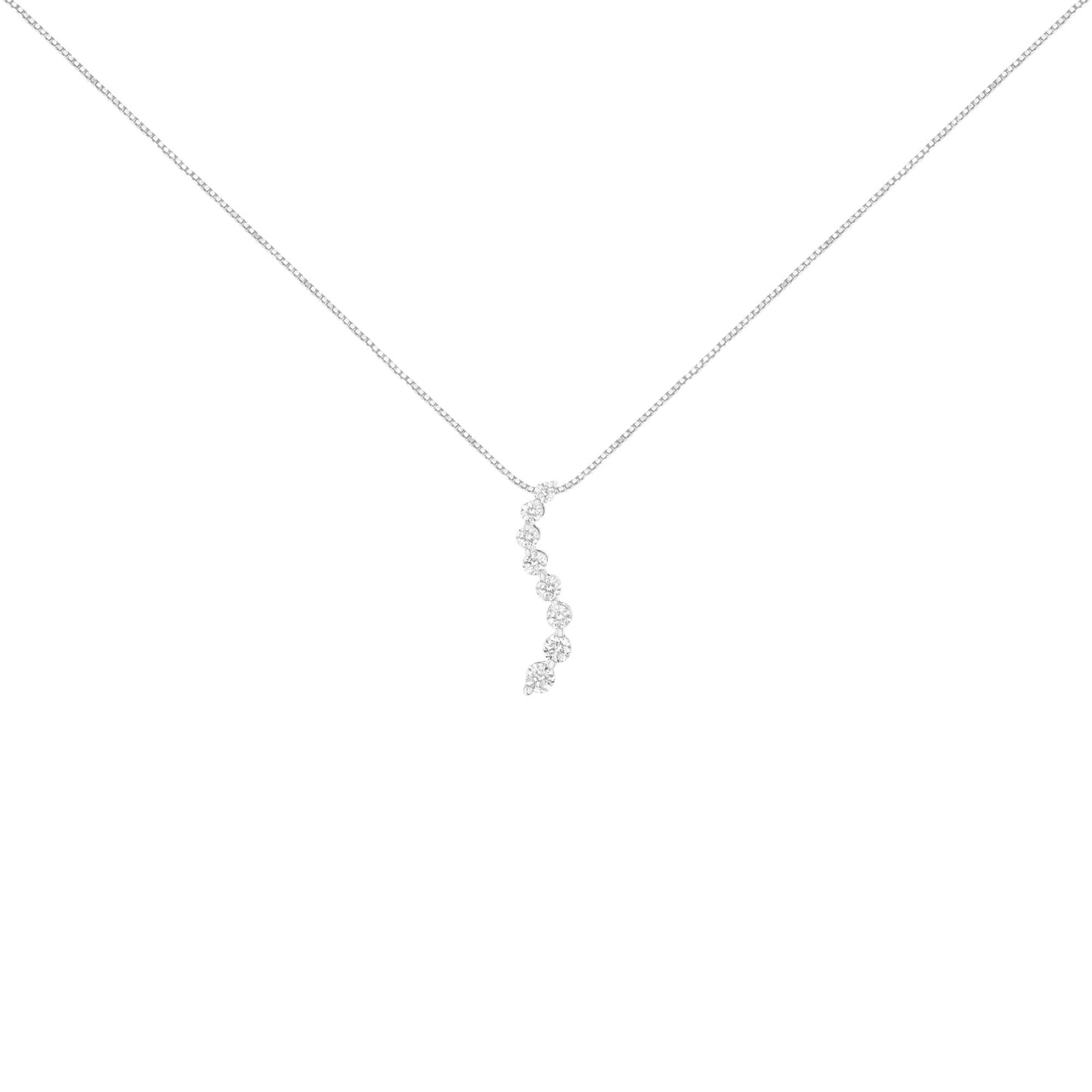 White metal necklace with a vertical curved pendant featuring round prong-set brownish gemstones, shown from front angle.