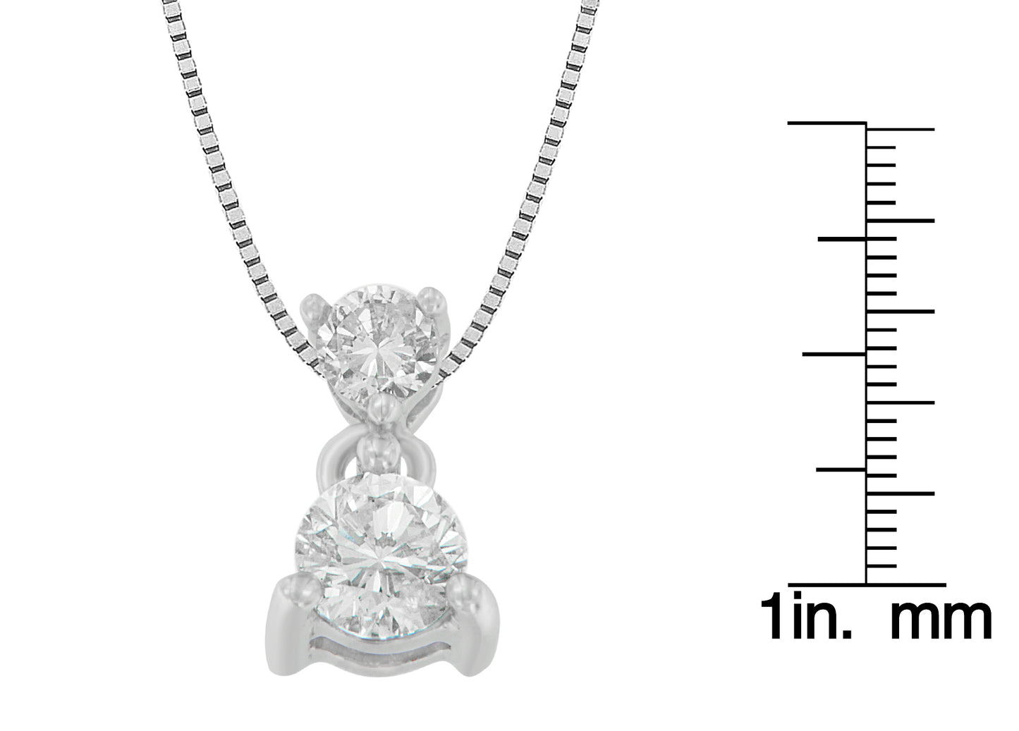 Close-up front view of a white metal necklace with two round white gemstones in prong settings, displayed next to a ruler for size reference.