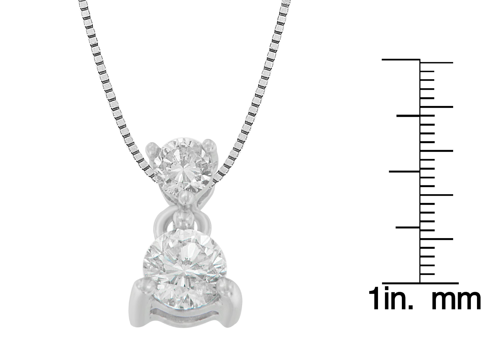 Close-up front view of a white metal necklace with two round white gemstones in prong settings, displayed next to a ruler for size reference.