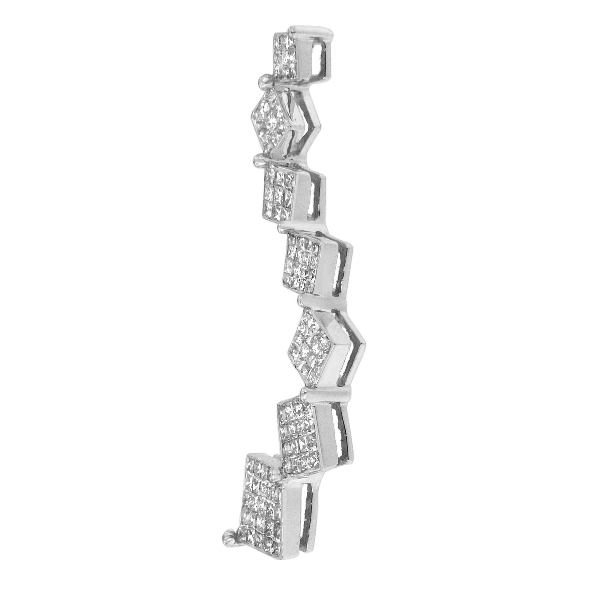 Side angle view of a white metal necklace segment featuring multiple princess-shaped white gemstones in a channel setting.