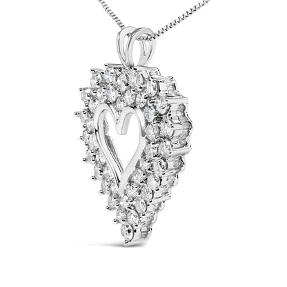 Pendant necklace with a white metal heart design surrounded by round and baguette white gemstones, shown in a close-up angled view.